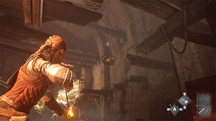 Fire Ignifer at the hanging basket (attached screenshot) - Plague Tale Requiem: Chapter 2, Exit the arenas underground - walkthrough - Chapter 2 - Newcomers - A Plague Tale Requiem Guide, Walkthrough
