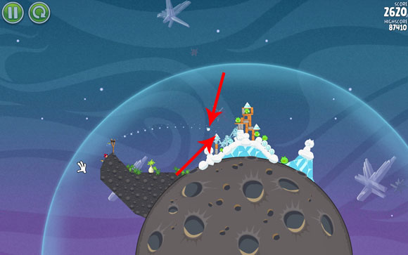 Launch the second bird so that its flight path goes a bit above the frozen triangle indicated on the above screen - Level 2-7 - Cold Cuts - Angry Birds Space - Game Guide and Walkthrough