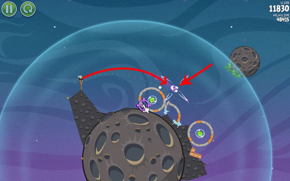 The next bird has it easy - launch it above the first hoop and, when it passes it, change the course so that it crosses paths with the wooden blocks and the piglet - Level 2-5 - Cold Cuts - Angry Birds Space - Game Guide and Walkthrough