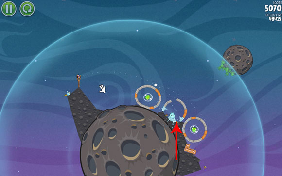 Launch the second bird on an almost identical trajectory (close to the first hoop), splitting just before it reaches the second hoop - Level 2-5 - Cold Cuts - Angry Birds Space - Game Guide and Walkthrough