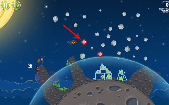 The first solution is to push the circled asteroid by detonating the bird more or less at the indicated spot, so that the