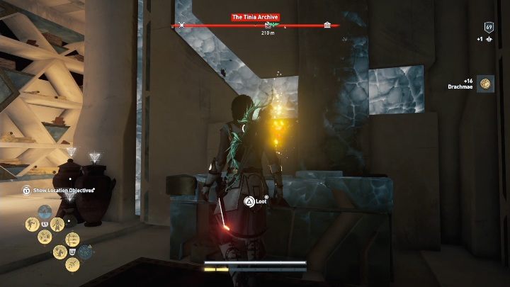 A chest is located between the walls on the left side of the building - AC Odyssey Fate of Atlantis: The Tinia Archive - Archives - Assassins Creed Odyssey Guide