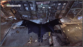 Stand on the roof north of the Trophy #1 and glide towards the wooden wall #2 - Batman trophies (15-24) | Park Row - Park Row - Batman: Arkham City Game Guide