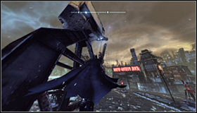 In order to safely leave the cage, you will have to use the Grapnel Boost - Batman trophies (01-10) | Amusement Mile - Amusement Mile - Batman: Arkham City Game Guide