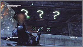 Now use the Grapnel Gun to reach the roof of the nearest building and turn towards the three question marks on the upper level #1 - Batman trophies (11-18) | Amusement Mile - Amusement Mile - Batman: Arkham City Game Guide