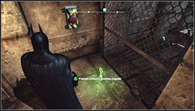 Equip the Line Launcher and shoot it at the wall behind the electrified floor #1 - Batman trophies (17-25) | Industrial District - Industrial District - Batman: Arkham City Game Guide
