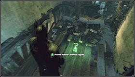 Stand east of the Trophy, look up and use the Grapnel Gun to reach the upper ledge #1 - Batman trophies (01-12) | Wonder City - Wonder City - Batman: Arkham City Game Guide