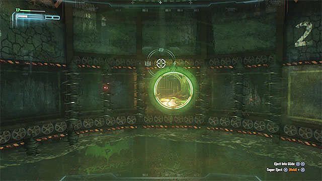 Keep lowering the batmobile, up to the point at which it is located right above the operating drills - Seventh Riddler trial | Batman Arkham Knight - Riddlers Revenge - Batman: Arkham Knight Game Guide & Walkthrough