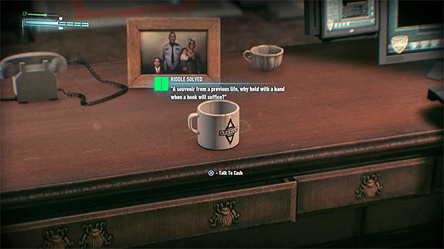 Officer Cashs desk - Riddles in GCPD Lockup | Collectibles - GCPD Lockup | Batman Arkham Knight - Collectibles - GCPD Lockup - Batman: Arkham Knight Game Guide & Walkthrough