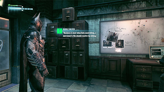 Take interest in the board in communications room - Riddles in GCPD Lockup | Collectibles - GCPD Lockup | Batman Arkham Knight - Collectibles - GCPD Lockup - Batman: Arkham Knight Game Guide & Walkthrough