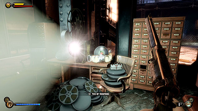Wardens Office - on a desk next to an active projector - Chapters 32-35 | Voxophones in BioShock Infinite - Voxophones - BioShock Infinite Guide