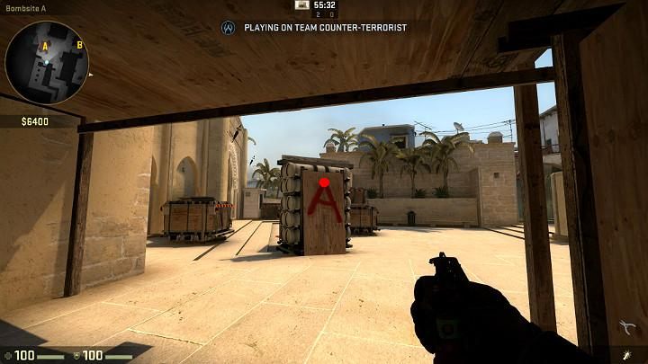 While under the wooden balcony in point A, aim at the point shown in the above screenshot and throw the grenade with LMB - Mirage | Tournament maps in CS GO - Tournament Maps in Counter Strike: Global Offensive - CS GO Game Guide