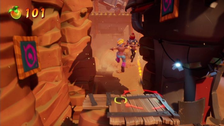 On the other side, you'll find a bomb-using opponent and a wall to climb - Crash 4: Truck Stopped walkthrough - The Hazardous Wasted, 2084 - Crash 4 Guide, Walkthrough