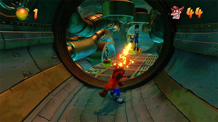 After the stage starts, walk around the nitroglycerine crate and the robots - Crash Bandicoot N. Sane Trilogy: Sewer or Later - Crash Bandicoot N. Sane Trilogy: Crash Bandicoot 2 - Sewer Warp Room - Crash Bandicoot N. Sane Trilogy Game Guide