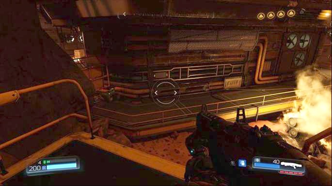 Further path leads through the door below - Doom: Destroyed Argent Facility Walkthrough - Doom: Walkthrough - Doom Game Guide & Walkthrough