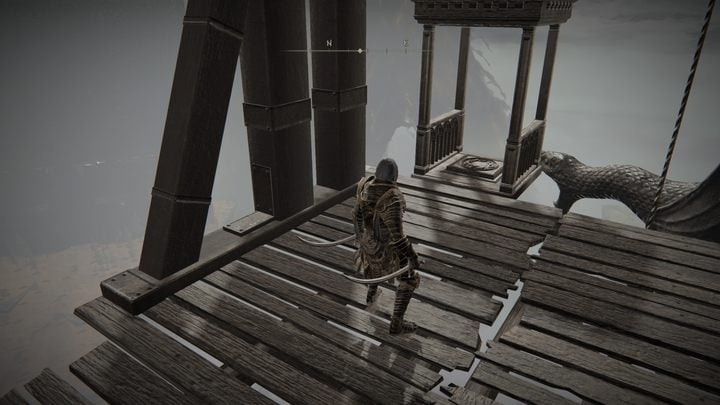 After reaching the stone balcony with shelves, go out into the open space and head to the elevator car - Shadow of the Erdtree: How to open the passage behind the headless statue? - Shadow of the Erdtree: Secret locations - Elden Ring Guide