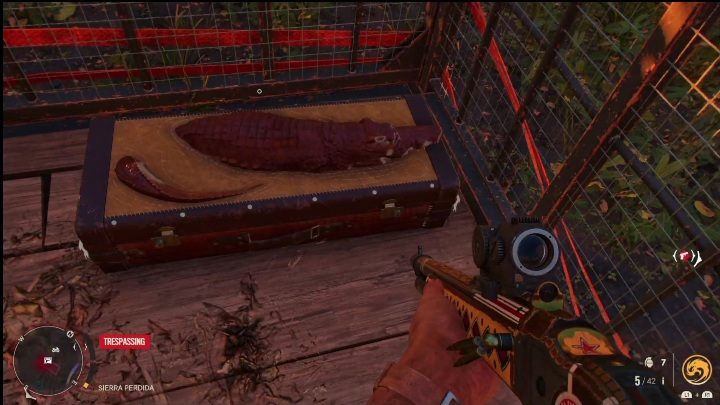 The chest is in a cage that has been secured with straps - Far Cry 6: Best weapons for stealth kills - list - Basics - Far Cry 6 Guide