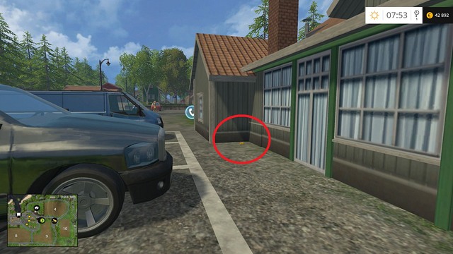 In the corner of a building near the phone - Section B - coins 13 - 29 - Gold Coins - Farming Simulator 15 Game Guide