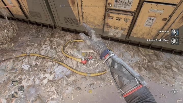 The first generator is on the square, right next to the elevator - approach it and interact with the cable lying on the ground - Dying Light 2: Is it worth to help Anderson? Into the Dark - Important Choices - Dying Light 2 Guide