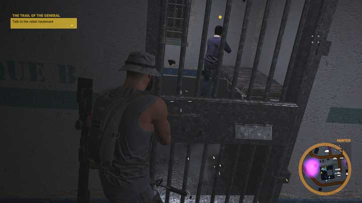 Enter the building on the left and check all the prison cells - The Trail of the General | Flor De Oro walkthrough - Flor De Oro - Tom Clancys Ghost Recon: Wildlands Game Guide