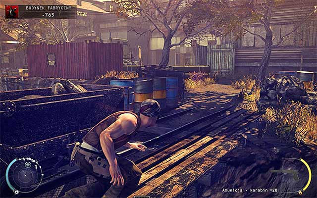 After reaching the other side of the bridge, make sure that the guard who may appear here wont spot you - Factory Compound - Reaching the main complex | 11: Dexter Industries - 11: Dexter Industries - Hitman: Absolution Game Guide