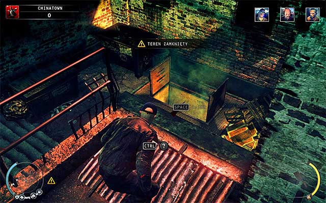 While waiting for Larry and a clerk, depending on your preferences, you can stay on the upper balcony (screen above) or jump down and hide inside a container - Chinese New Year - Eliminating Larry Clay | 5: Hunter and Hunted - 5: Hunter and Hunted - Hitman: Absolution Game Guide