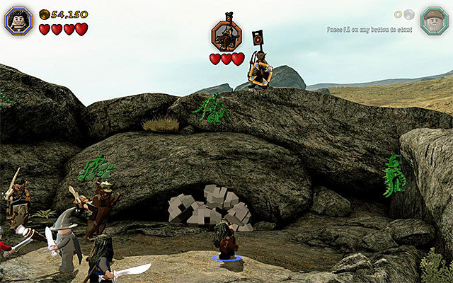 If you have completed Radagasts chase scene, then there will soon appear the orc leader, above the field, and he is a mini-boss - Stage 5 (The Troll Hoard): The orc encounter | Walkthrough | LEGO The Hobbit - Walkthrough - LEGO The Hobbit Game Guide & Walkthrough
