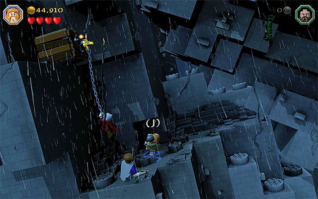 After Dori reaches the catch, you need to leap towards him, as any character - Stage 6 (Over Hill and Under Hill): Climb the stone giant | Walkthrough - Walkthrough - LEGO The Hobbit Game Guide & Walkthrough