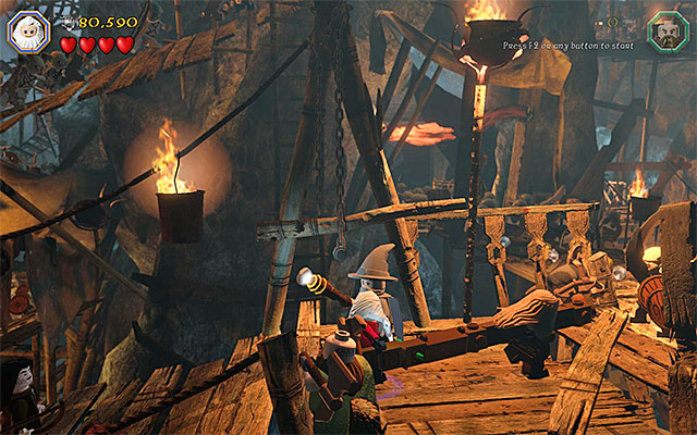 You need to use the beam to clear the area of goblins - Stage 7 (Goblin-town): Escape from the goblin city | Walkthrough - Walkthrough - LEGO The Hobbit Game Guide & Walkthrough
