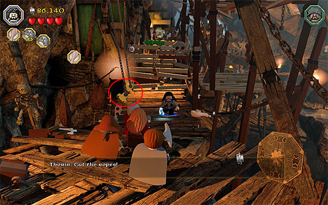Walk over the lowered drawbridge and deal with the goblins - Stage 7 (Goblin-town): Escape from the goblin city | Walkthrough - Walkthrough - LEGO The Hobbit Game Guide & Walkthrough