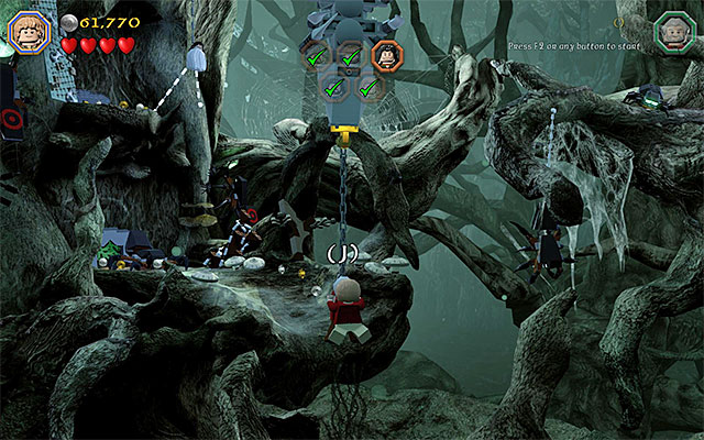 You need to jump towards Dori on the chain - Stage 10 (Flies and Spiders): The spider cave | Walkthrough | LEGO The Hobbit - Walkthrough - LEGO The Hobbit Game Guide & Walkthrough