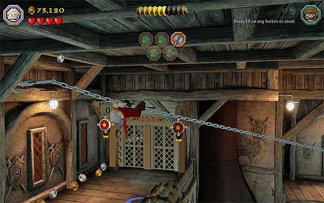 You need to walk over the chain to the balcony on the left - Stage 12 (A Warm Welcome): The armory | Walkthrough | LEGO The Hobbit - Walkthrough - LEGO The Hobbit Game Guide & Walkthrough