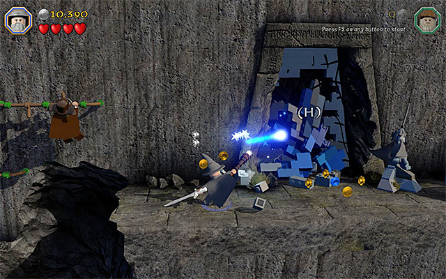 The wall with the entrance to the tomb behind it - Stage 13 (Looking for Proof): The mountain path | Walkthrough | LEGO The Hobbit - Walkthrough - LEGO The Hobbit Game Guide & Walkthrough