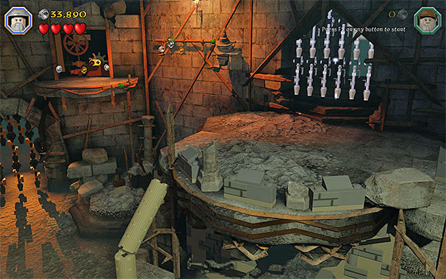You will reach the shelf with the second knob, by grabbing the ledge - Stage 14 (The Necromancer): The keeps interior | Walkthrough - Walkthrough - LEGO The Hobbit Game Guide & Walkthrough