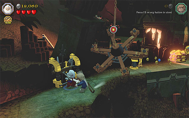 After you destroy the weapon stand, you will be able to collect the bow - Stage 16 (Inside Information): The vault | Walkthrough - Walkthrough - LEGO The Hobbit Game Guide & Walkthrough