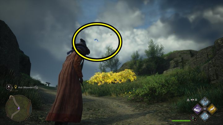 One of the Flying Guide Pages #18 (Hogsmeade) is flying by the path near the Dogweed and Deathcap shop - Hogwarts Legacy: Field Guide Pages Part 2 - Hogsmeade - Hogwarts Legacy: Hogsmeade Collectibles - Hogwarts Legacy Guide