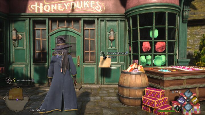 The next page is in front of the candy store entrance - Hogwarts Legacy: Field Guide Pages Part 2 - Hogsmeade - Hogwarts Legacy: Hogsmeade Collectibles - Hogwarts Legacy Guide