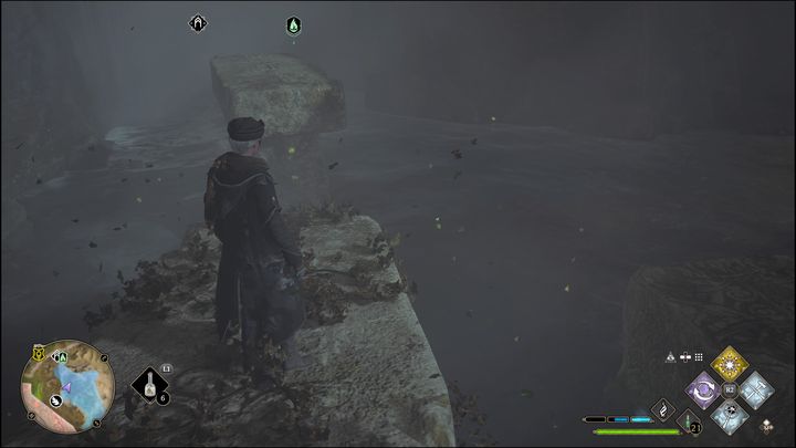 Once you're in the middle, instead of jumping to the platform below, first take a long run and jump over the chasm to catch the edge of the stone structure in front of you - Hogwarts Legacy: Poidsear Coast - all Merlin Trials - Hogwarts Legacy: Merlins Trials - Hogwarts Legacy Guide