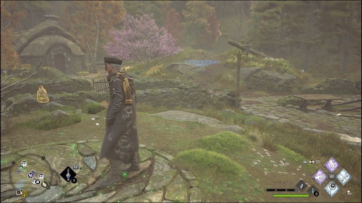 In this test, you have to guide a large ball to a depression in the ground, which is highlighted in blue in the picture - Hogwarts Legacy: Hogwarts Valley - all Merlin Trials - Hogwarts Legacy: Merlins Trials - Hogwarts Legacy Guide