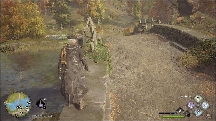 Guide the orb across the bridge , as the hole in the ground you need to lead it to is on the other side - Hogwarts Legacy: Hogwarts Valley - all Merlin Trials - Hogwarts Legacy: Merlins Trials - Hogwarts Legacy Guide