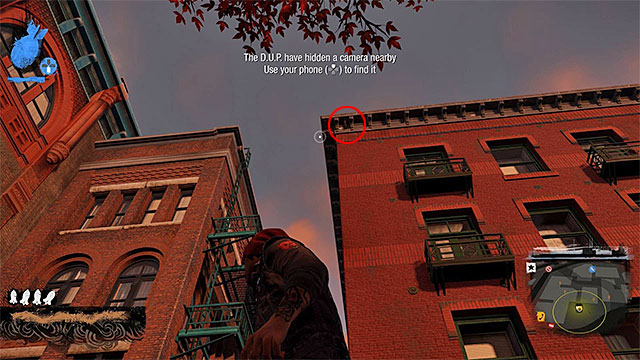 2) Hidden Camera - The camera you're looking for is located in the place shown on the above screen - Georgetown - more difficult activities - City - inFamous: Second Son - Game Guide and Walkthrough