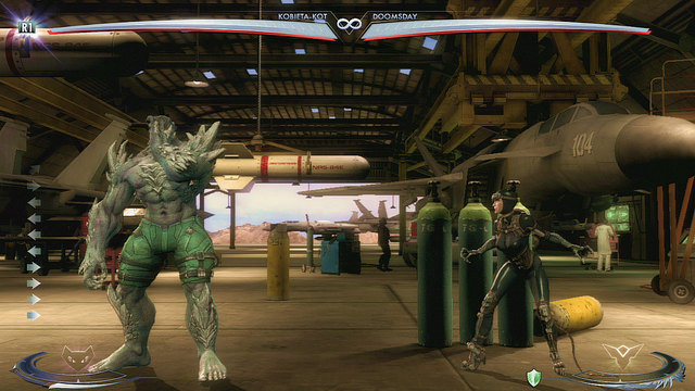 On the right side of the arena, nearby the middle there are green gas tanks - Injustice Gods Among Us: Ferris Aircraft, arena guide - Arenas - Injustice: Gods Among Us Game Guide