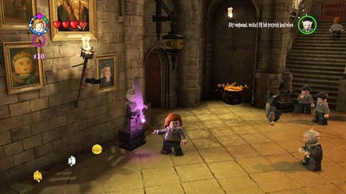 Find a statue of a knight with a small sword (it is located on the left, just at the exit from this location) - Harry Potter Years 5-7: Tokens - Hogwarts, part 6 - Tokens - LEGO Harry Potter Years 5-7 Guide