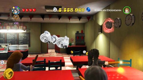 Set the clock hanging on the right wall and you will get Petunia (green coat) token - Harry Potter Years 5-7: Tokens - London, part 2 - Tokens - LEGO Harry Potter Years 5-7 Guide