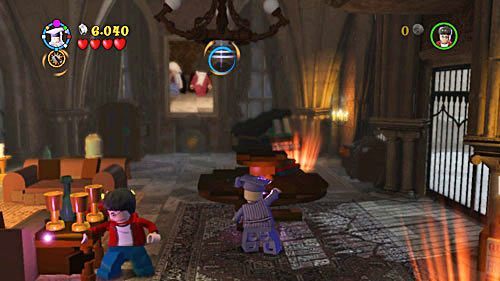 Use RD spell to destroy a round table and items lying on them - this way you can get a key to the cabinet - Harry Potter Years 5-7: Love Hurts, part 1 - Year 6 - LEGO Harry Potter Years 5-7 Guide