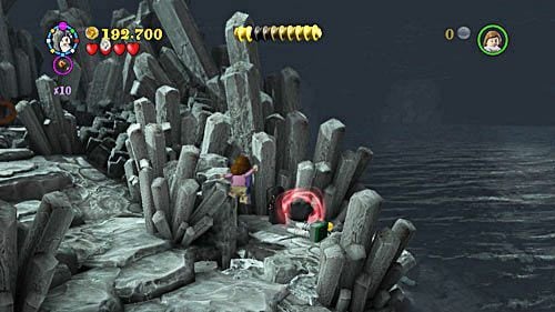 To get Tom Riddle (orphan) token, destroy three black rocks on the island in the middle of the reservoir - Harry Potter Years 5-7: Horcrux and the Hand - secrets, collectibles - Year 6 - LEGO Harry Potter Years 5-7 Guide