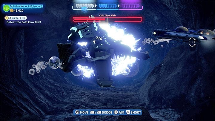 After a short while the second boss, the Colo Claw Fish, will appear - LEGO Skywalker Saga: A Bigger Fish - walkthrough - LEGO Skywalker Saga: Episode 1 - The Phantom Menace - LEGO Skywalker Saga Guide