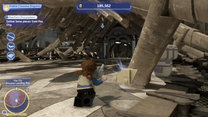 Follow the marker until you reach an area with a huge skeleton inside, then collect 10 bone pieces - LEGO Skywalker Saga: Pod Parts Procurement - walkthrough - LEGO Skywalker Saga: Tatooine - Mos Espa - LEGO Skywalker Saga Guide