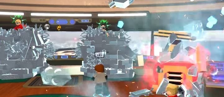 In the second part of the encounter you need to destroy the control panel located to the right of the enemies - Screenslaver Showdown - Level 6 in LEGO The Incredibles Walkthrough - Walkthrough - LEGO The Incredibles Game Guide