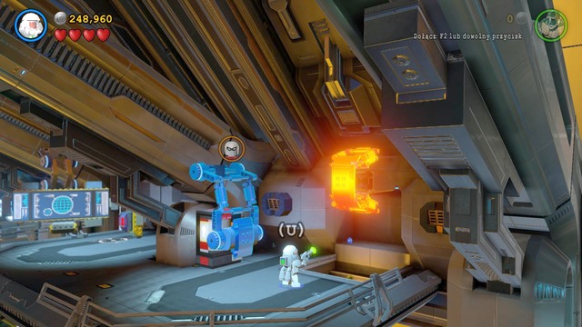 As Robin, approach the platform and press the correct button to get on it, then wear the Magnet Suit to remove the blue clamp - Space Station Infestation - Walkthrough - LEGO Batman 3: Beyond Gotham - Game Guide and Walkthrough